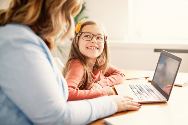 Mother helping daughter study