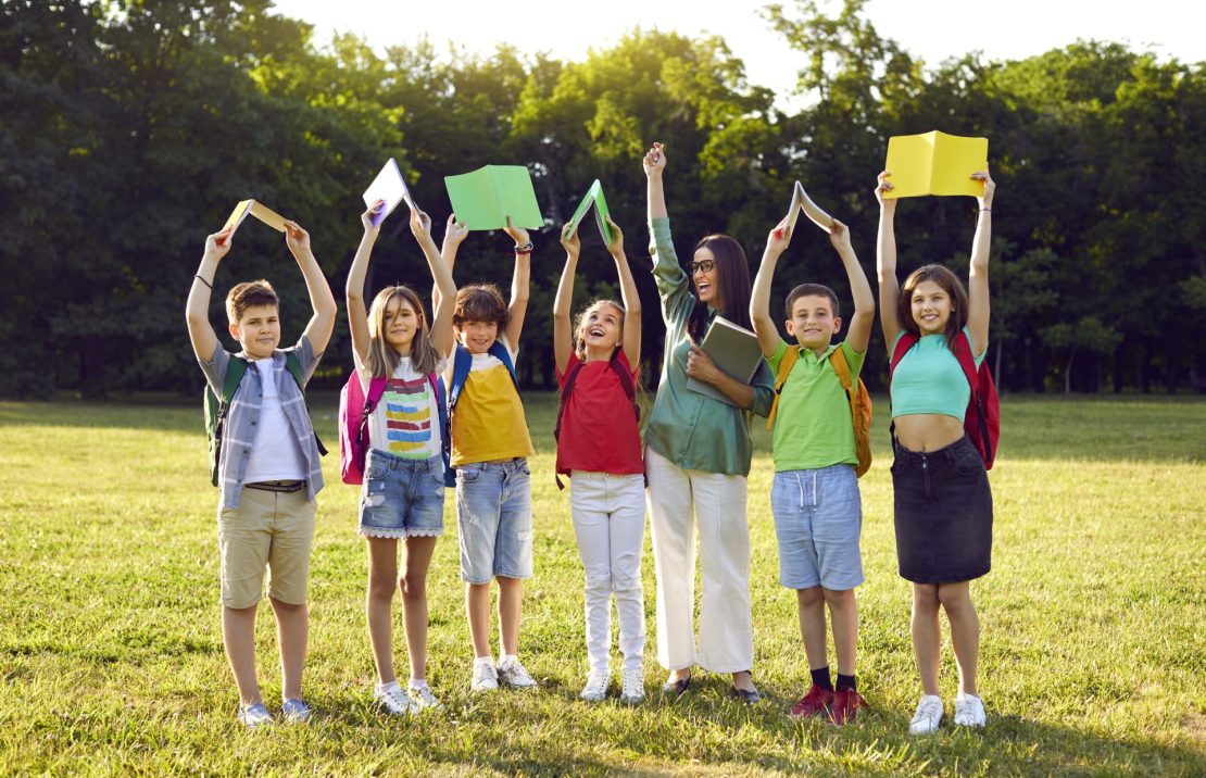 Kids holding up color-coded books, ADHD, time management