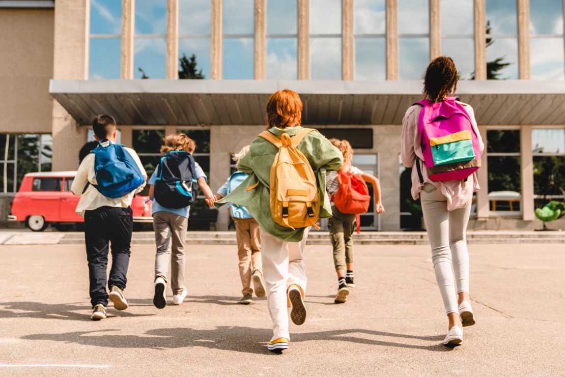 Kids with organized materials starting the new school year