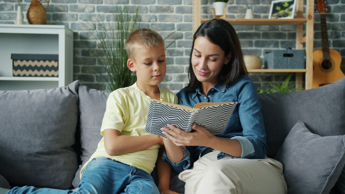A tutor working one-on-one with a child using hands-on learning materials during a summer session, illustrating specialized summer tutoring for students with learning disabilities in NYC.